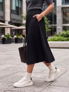 Womens Grand Crosscourt Arlowe Sneakers – Combine with a black pleated midi skirt and a fitted grey knit top for a chic, feminine ensemble.
