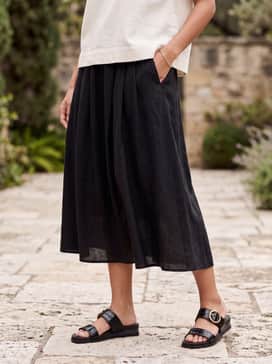 Womens Oaklynn Double Band Footbed Sandals – A midi-length emerald green slip dress layered with an oversized cream blazer for a sophisticated evening look.