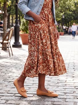Womens Payson Soft Bow Loafers – A floral midi-length tea dress in warm autumnal tones like rust and cream, topped with a light-wash denim jacket for a relaxed vibe.