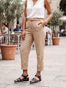 Womens Riginalgrand Peyton Flatform Sandals – High-waisted cropped linen trousers in a sand color, paired with a tucked-in white sleeveless silk blouse and delicate gold layered necklaces.