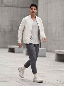 Y3 Adios Pro 4 Shoes – A high-performance training set featuring tapered charcoal joggers, a light grey moisture-wicking tank, and a technical ivory bomber jacket.