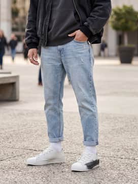 Y3 Nizzastar Lo Shoes – Relaxed light-wash denim paired with a heavyweight grey hoodie and a vintage-wash bomber jacket for an elevated casual vibe.