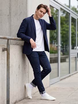 Y3 Stan Smith Lo Pro – A clean smart-casual outfit consisting of dark indigo slim-fit denim, a premium white heavy-weight t-shirt, and an unconstructed navy blue blazer.